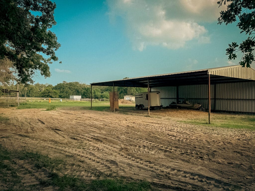 Cleared ground beside the barn after tree removal, Brazos Valley, TX